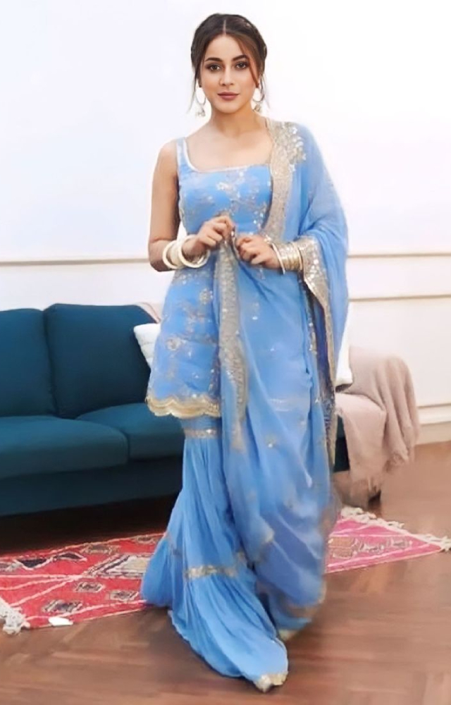 Are you looking for the perfect Lohri suit that incorporates contemporary fashion? Take notes from Shehnaaz Gill`s powder blue suit.