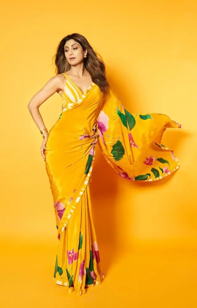 Shilpa Shetty can never go wrong with a saree. She wore a bright yellow floral printed saree with a matching blouse and radiated elegance