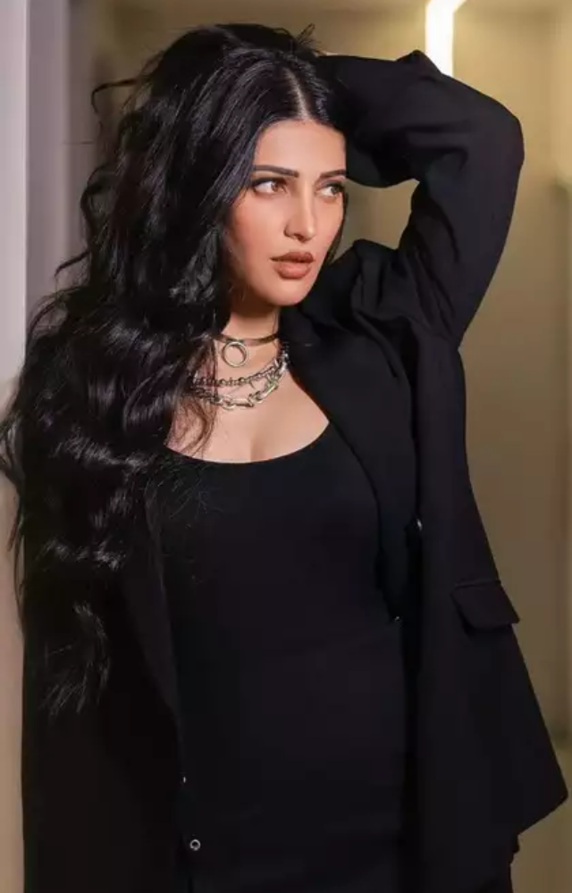 Shruti Haasan embraces black with edgy ensembles, incorporating leather, studs, or sheer fabrics to infuse her looks with a sense of rebellion and attitude.

