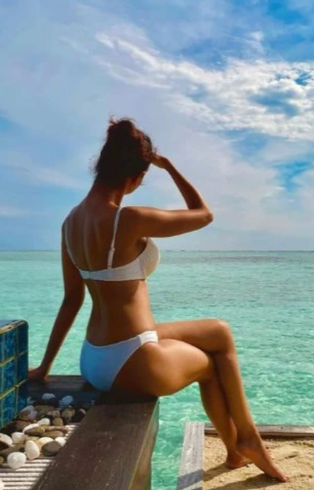 The Archies actress looks absolutely stunning in a white bikini as she poses in the tropical paradise of the Maldives.