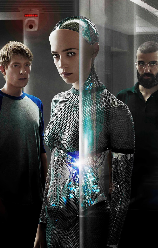 A programmer tests an advanced AI`s consciousness, blurring lines between human and machine. Claustrophobic tension