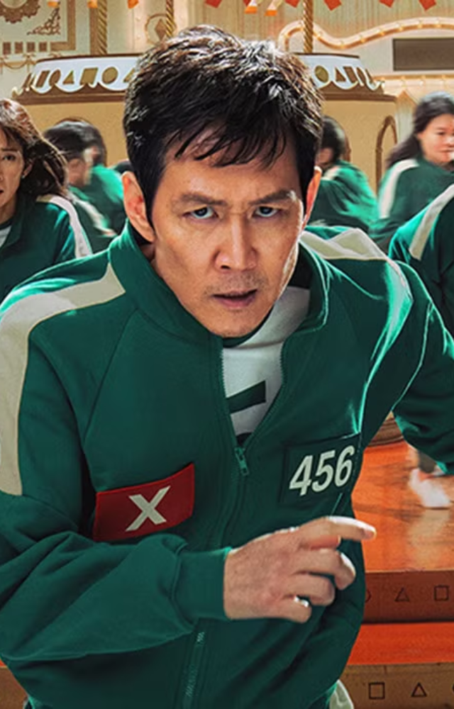 Gi-hun`s relentless pursuit of dismantling the Squid Game organisation consumes him, even two years after winning. This sets the stage for his return.