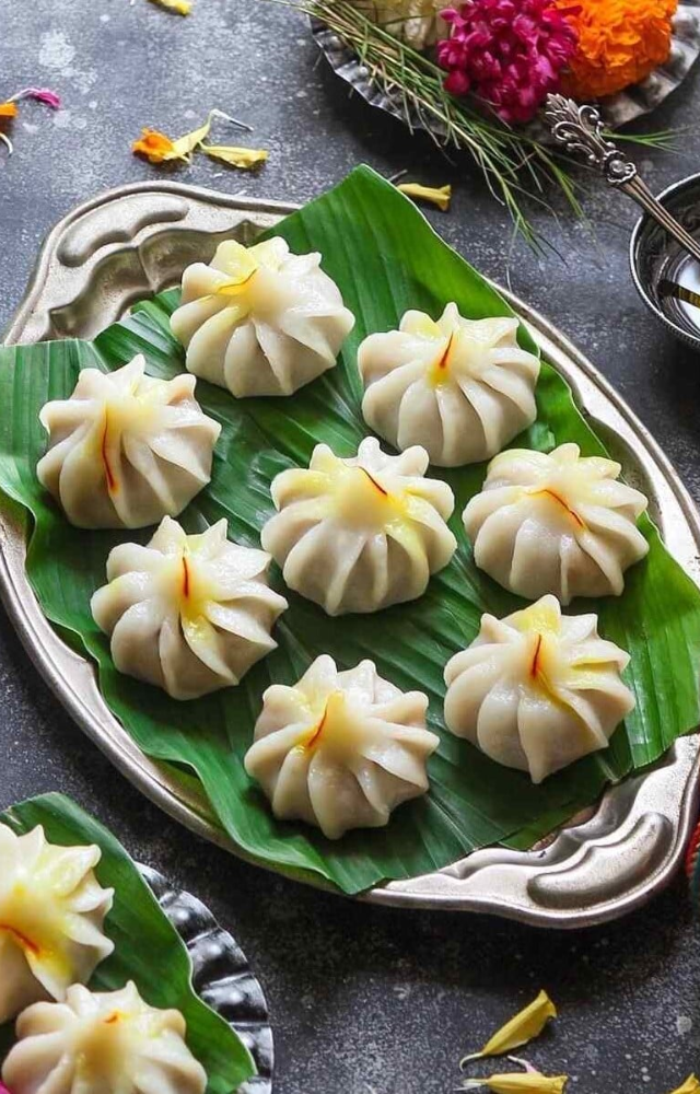Modaks are the most iconic sweets associated with Ganesh Chaturthi. They are made with a sweet filling of coconut and jaggery wrapped in rice dough.