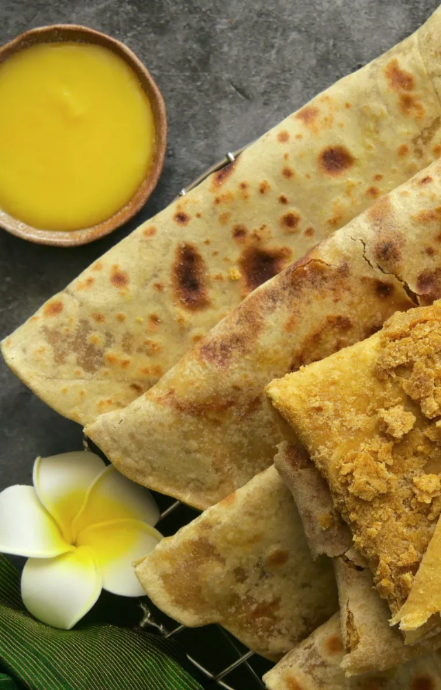 This Maharashtrian delicacy is a flatbread stuffed with a sweet filling made of lentils and jaggery. You can eat it with ghee or coconut milk.