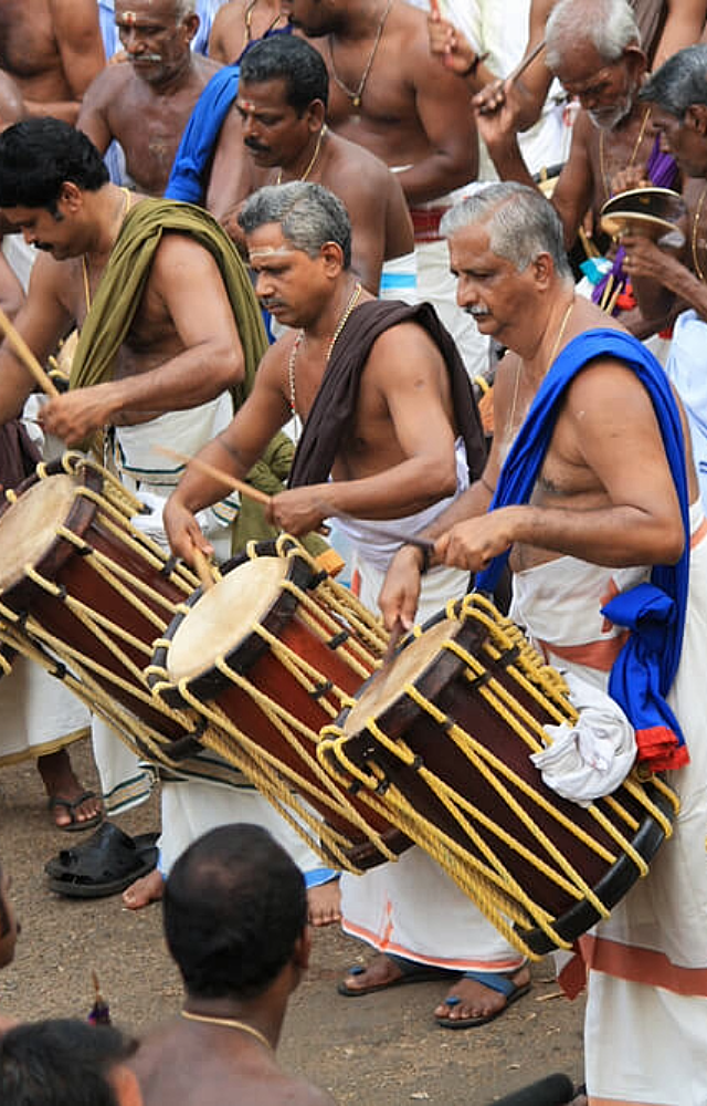 The festival is accompanied by the rhythmic beats of traditional percussion ensembles like `panchavadyam` and `melam`.