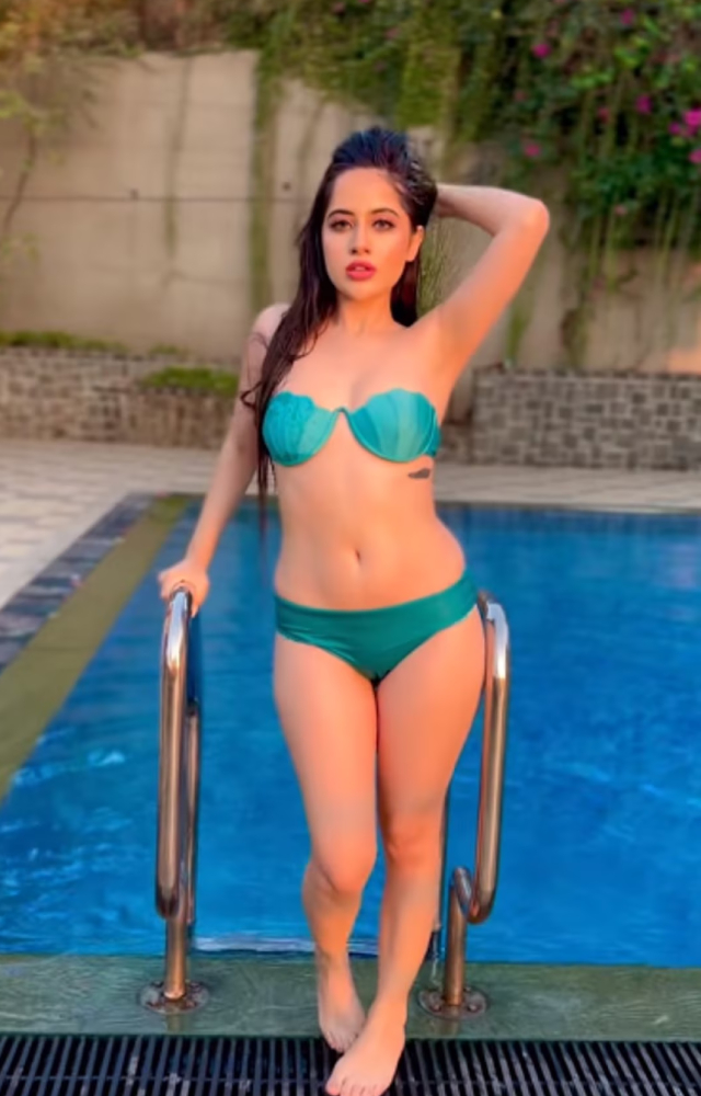 Urfi Javed looks stunning in a chic blue bikini, radiating confidence and charm amidst the summer`s warmth.