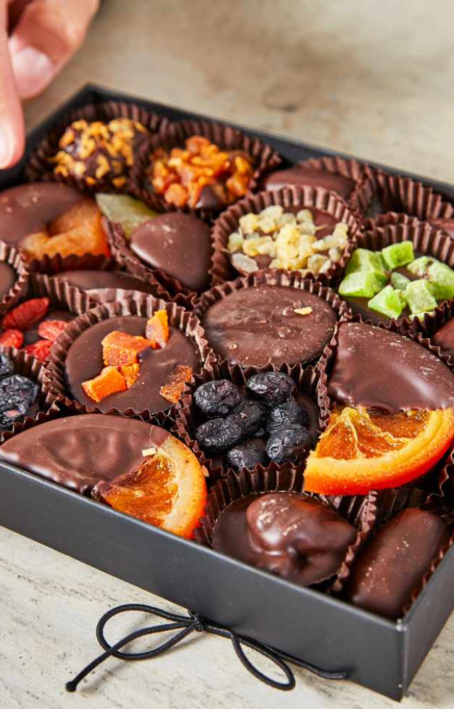 A sumptuous assortment of dark, milk, and white chocolate truffles, handcrafted with unique flavors for a truly indulgent experience.