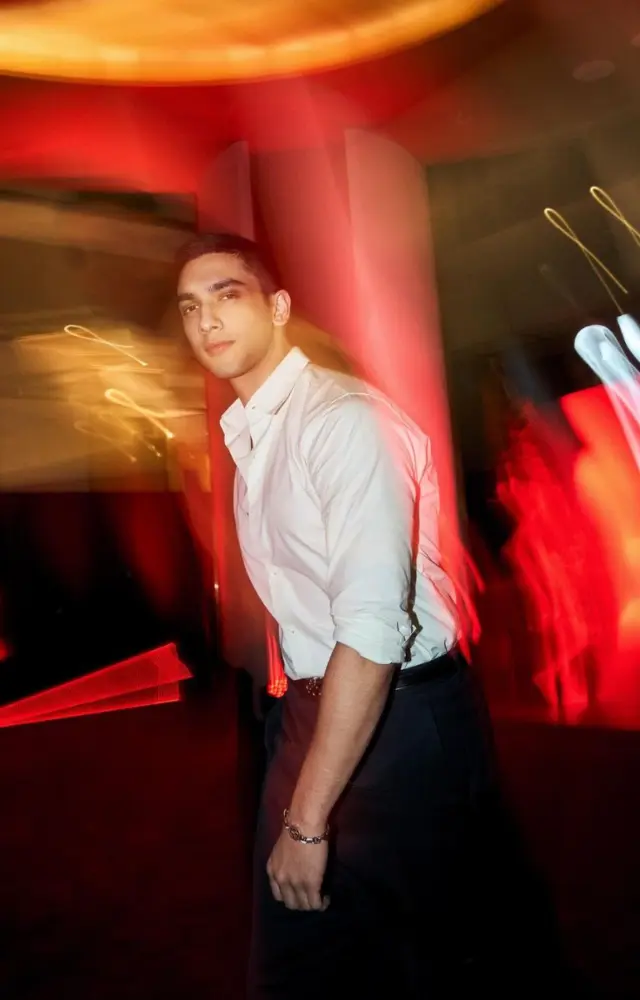 Vedang takes the classic white shirt to another level by rolling up the sleeves and pairing it with black pants