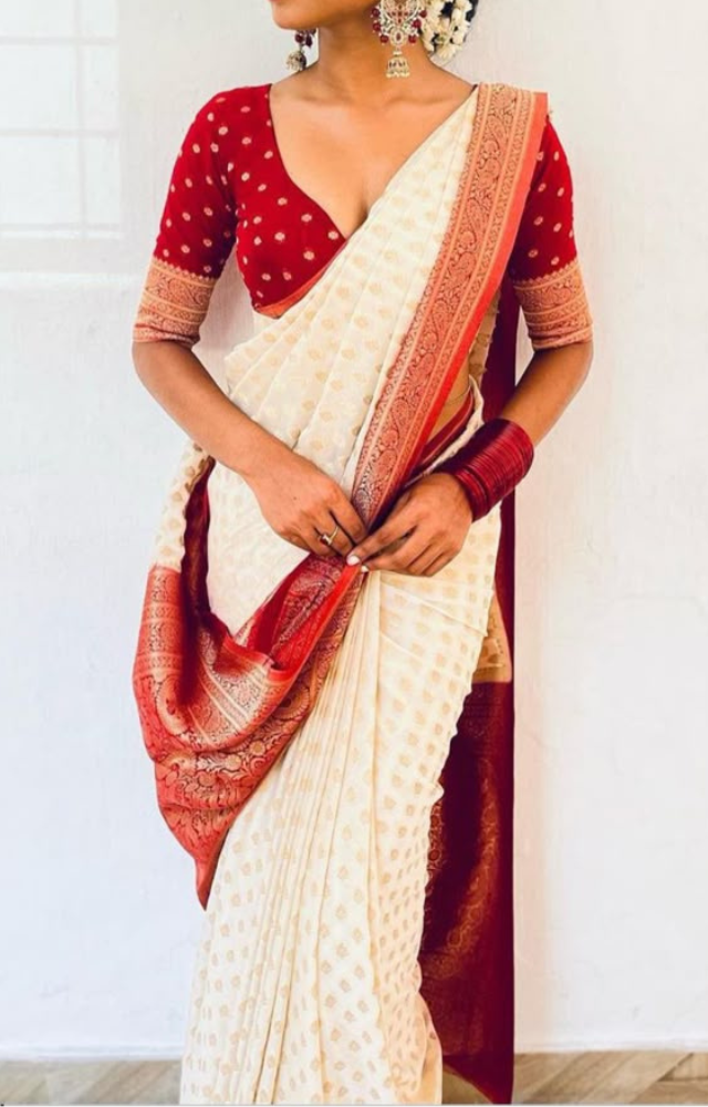 Vibrant silk sarees in gold, yellow, or green with subtle zari work & traditional accessories add festive flair to your outfit.

