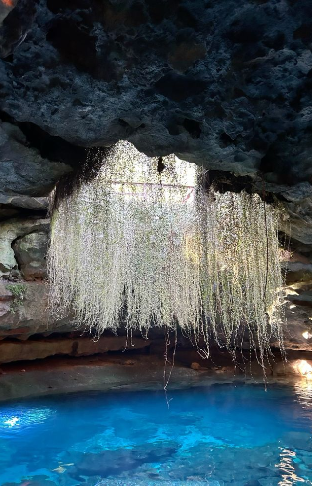 This underground spring has a dome-like ceiling where sound bounces in waves. Under certain conditions, it hums softly with air and water movement.

