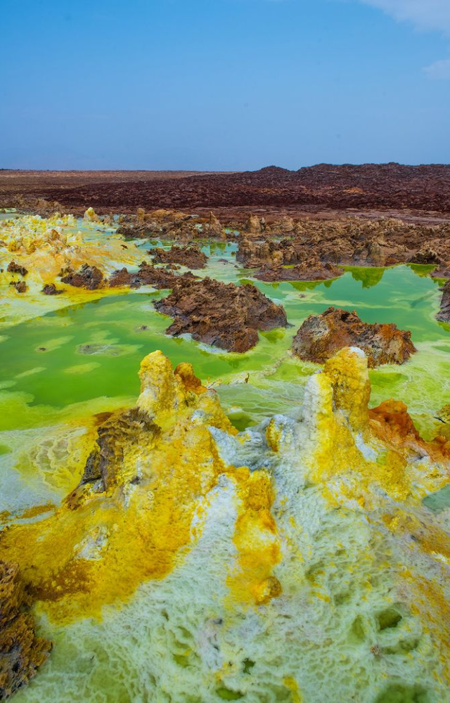Located in the Danakil Depression, these acidic rivers are surrounded by colorful, alien landscapes. Volcanic heat keeps them constantly steaming.
