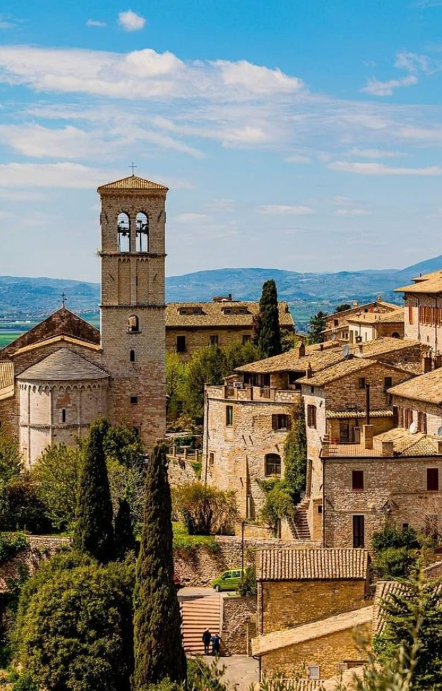 A medieval town where narrow cobbled streets don’t require traffic lights—vehicles navigate carefully through the winding alleys.

