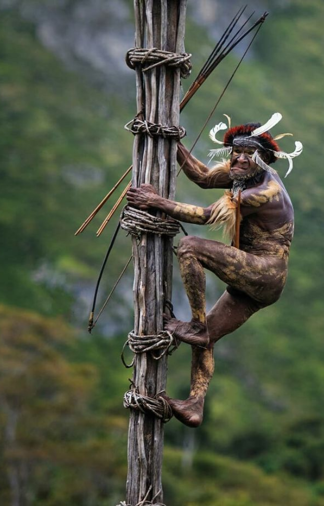 This tribe builds treehouses over 40 feet high. They had no contact with the outside world until the 1970s and still live off the land.

