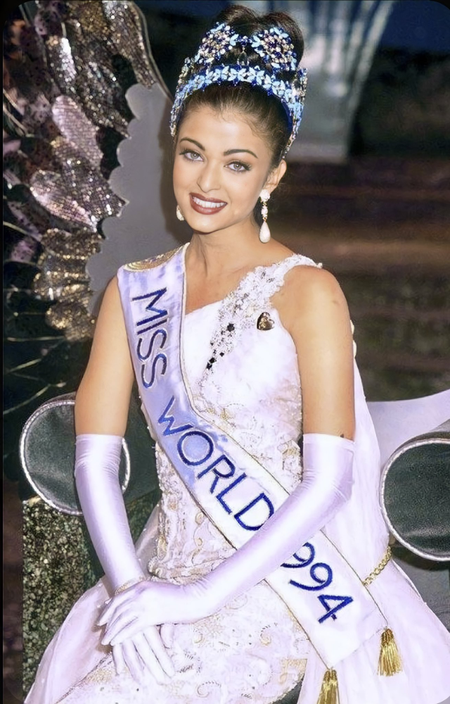 When she was crowned Miss World, she wore a white gown with one shoulder embellished with a pair of white gloves that shone.