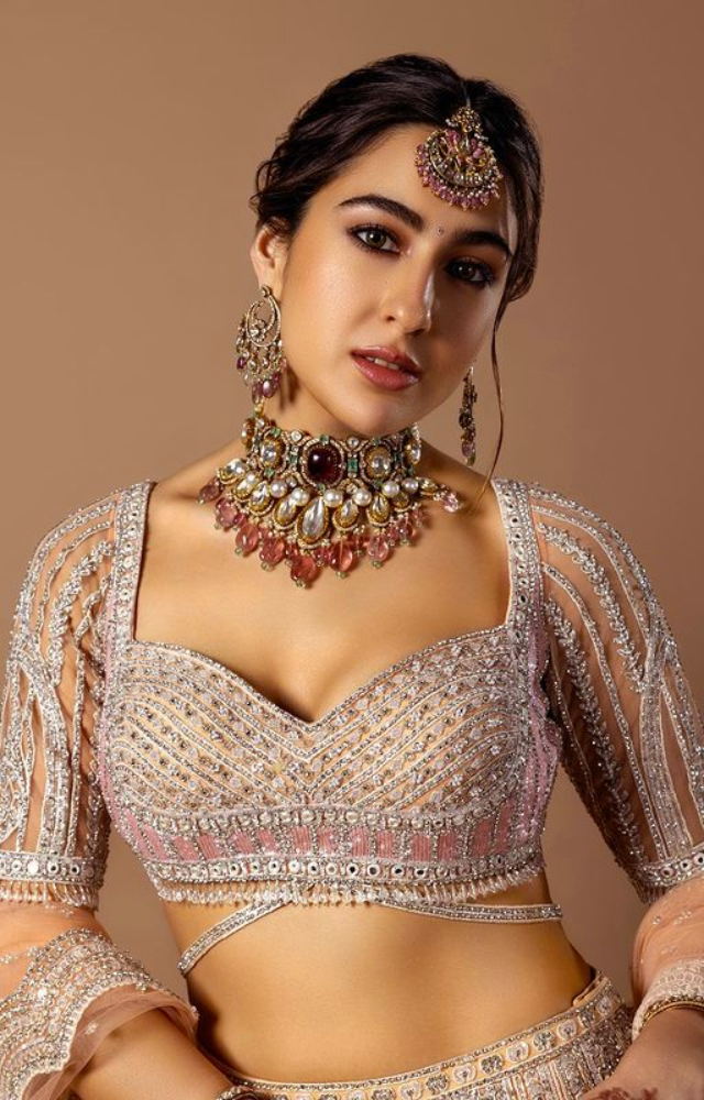 Sara Ali Khan stuns in a baby pink lehenga, radiating grace and charm with her ethnic ensemble.

