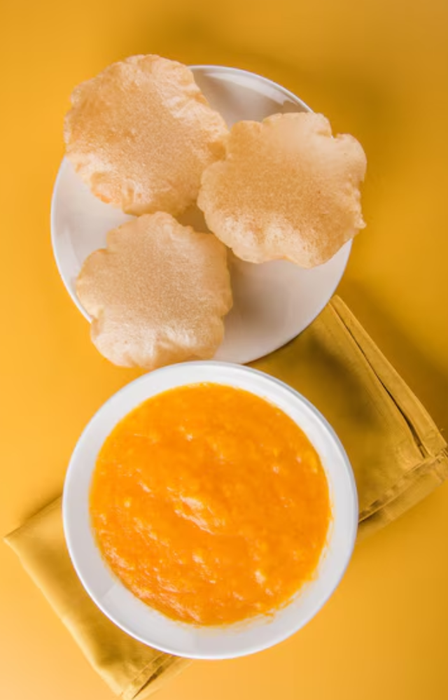 'Aam Ras,' a well-known mango treat that is consumed on special occasions like Akshaya Tritiya. Aam Ras, or deep-fried Indian bread, is usually eaten with puris