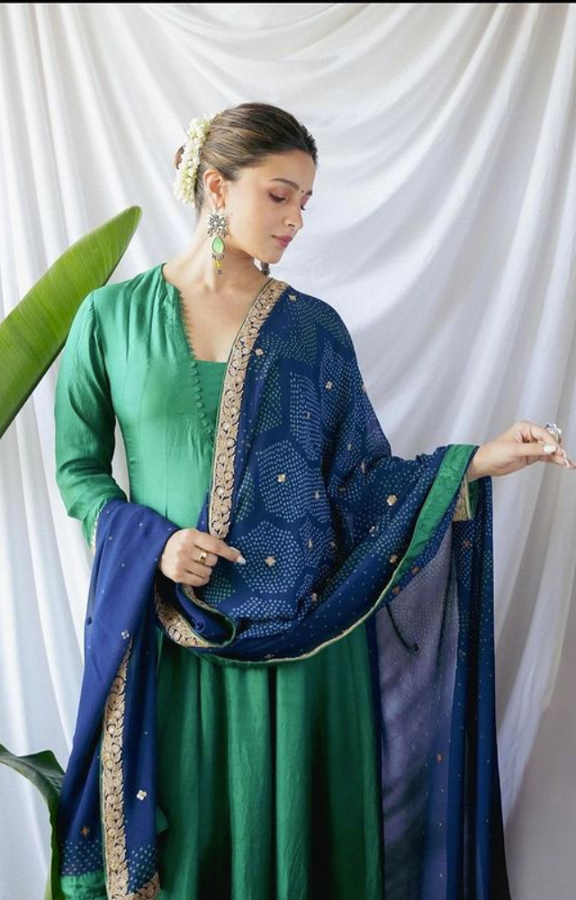Alia Bhatt stuns in a fusion of green and blue, epitomizing grace and trendiness in a vibrant ensemble.