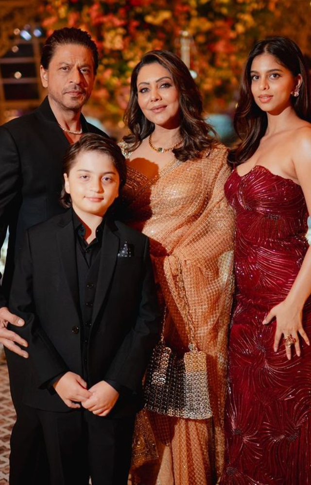  Shah Rukh Khan, accompanied by his family, graces the Ambani pre-wedding, adding his charismatic presence to the opulent celebration.