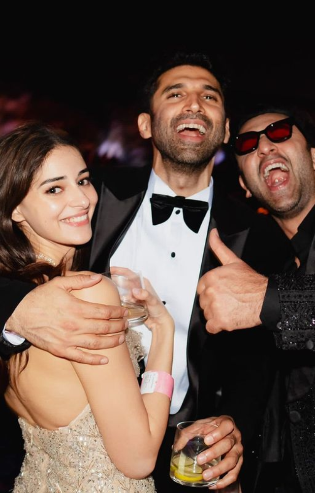 Aditya Roy, Ranbir Kapoor, and Ananya Pandey strike a stylish pose, enhancing the star-studded glamour at Ambani`s pre-wedding festivities.