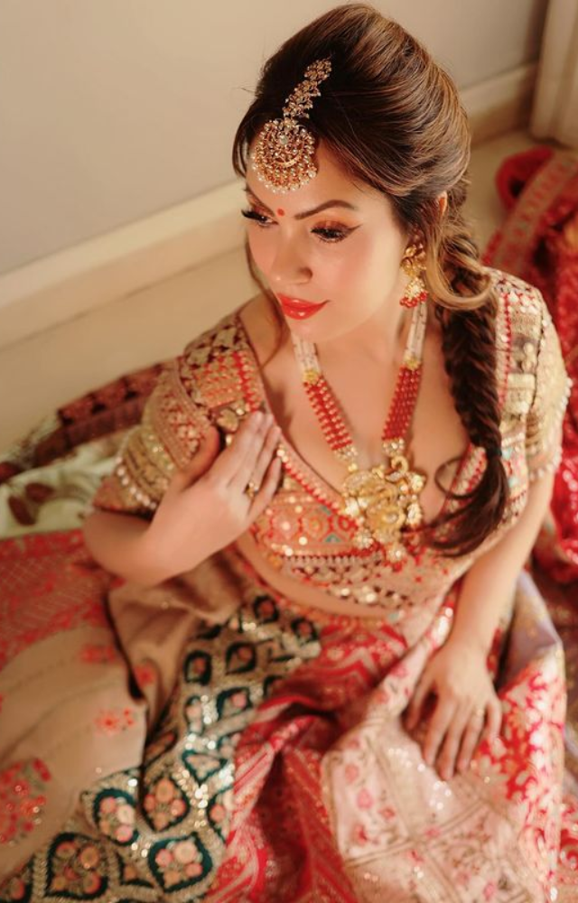 Munmun Dutta dazzles in a red lehenga during a stylish night, perfectly capturing elegance and flair in this gorgeous attire.
