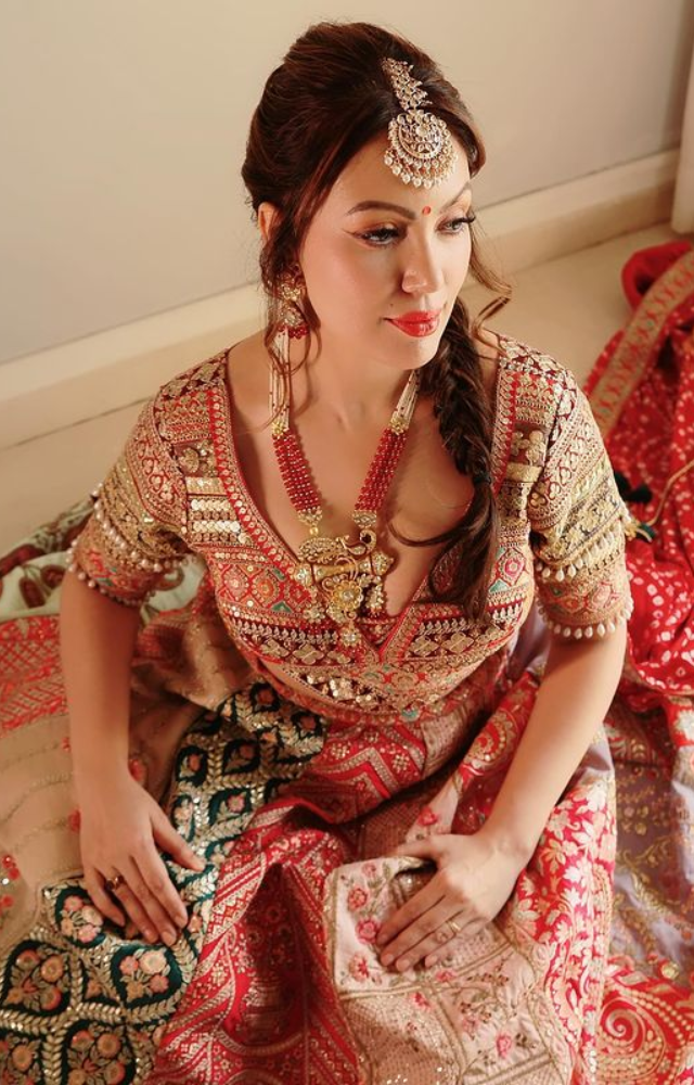 Munmun Dutta`s heart skips a beat when she walks into the scene in a red lehenga, a symbol of love and sophistication.