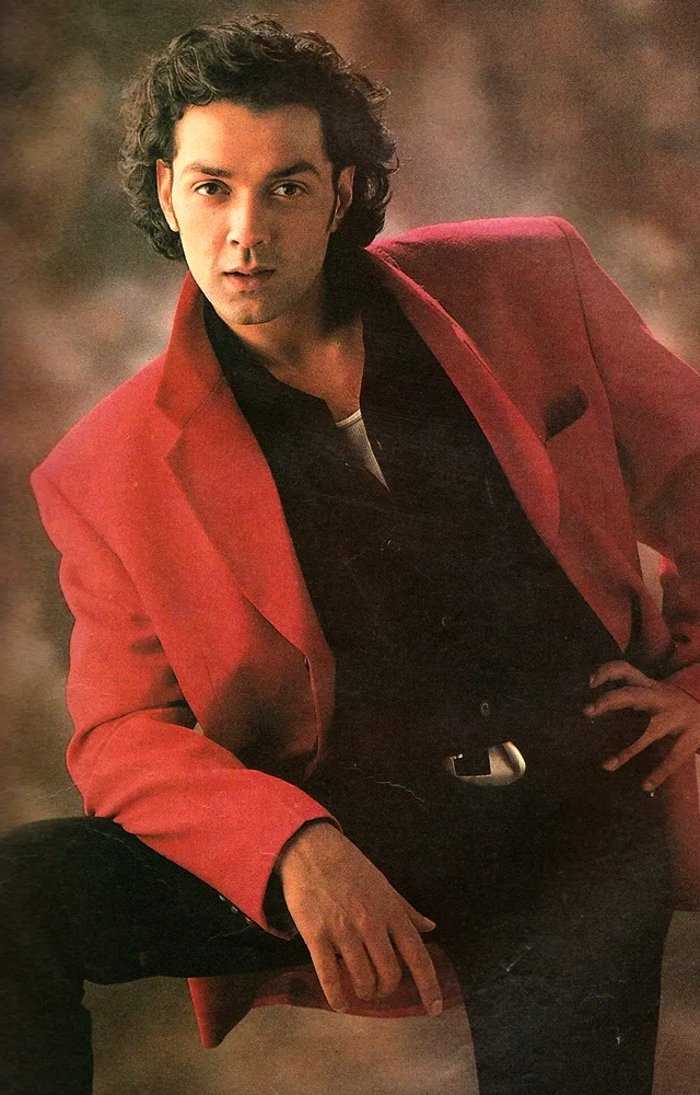 Bobbys 1990s outfits have a charming throwback vibe,he became a style icon of the time thanks to his impeccable sense of trendiness & sophistication in clothing