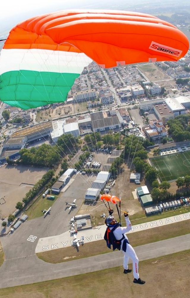 Farhan paraglides with an Indian colour parachute on Republic Day 2024, soaring high and representing liberty and nationalism.