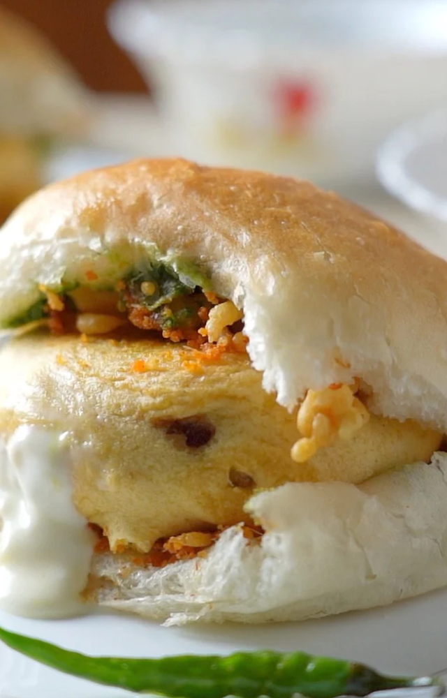 Popular Indian street snack called vada pav is named after the busy streets of Mumbai. It is made up of soft, fluffy pav (bread rolls) layered with a spicy vada