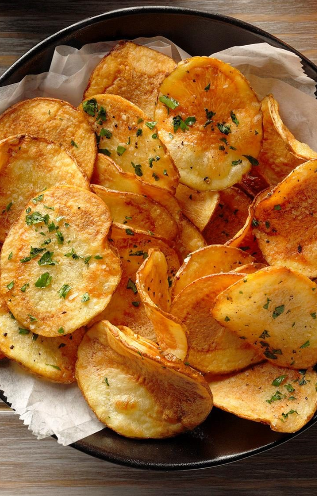Potato chips are thin slices of potatoes that are deep-fried or baked until crispy. They are seasoned with salt or various flavorings to enhance their taste. 
