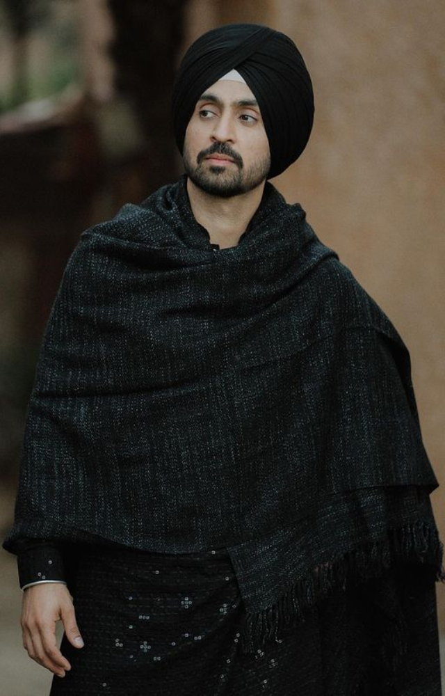Diljit Dosanjh combines sleek refinement with his natural charisma and captivating presence to effortlessly enchant in a black ensemble.