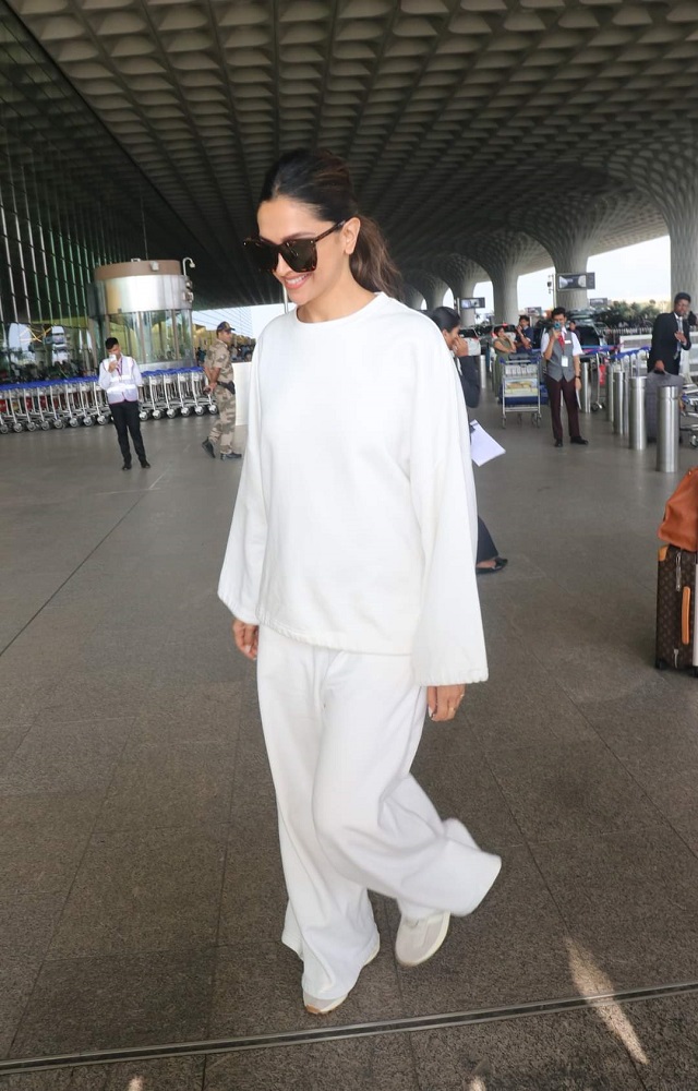 Deepika Padukone sets the airport ablaze with her stylish white outfit. 