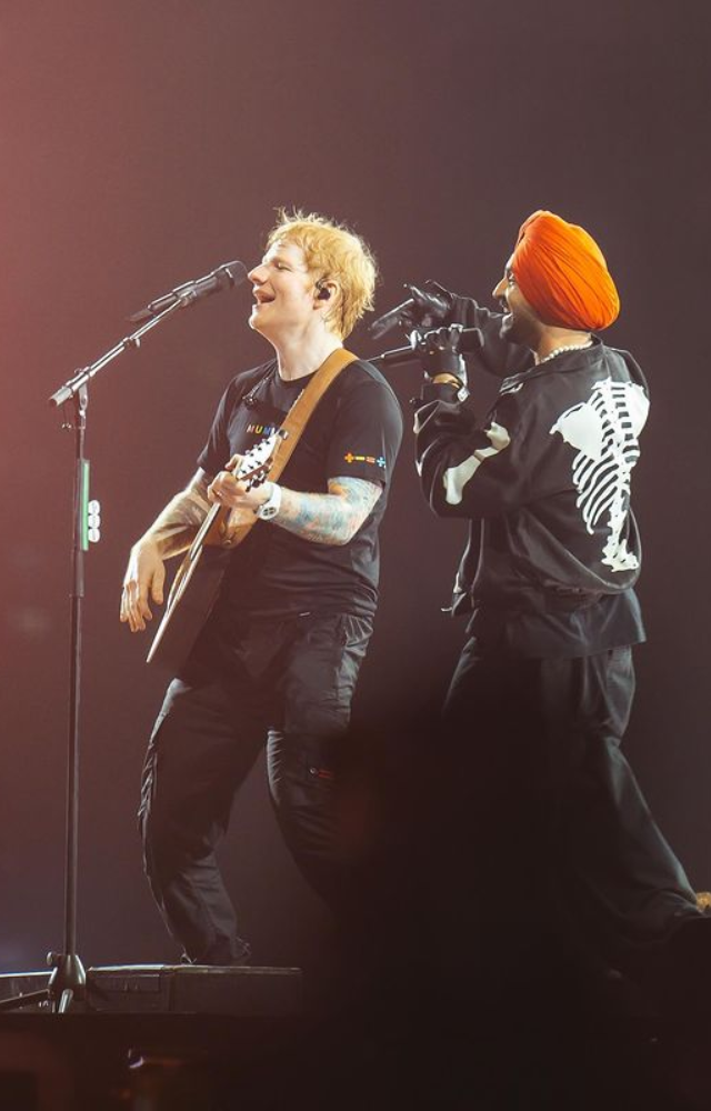 Diljit performing with Ed Sheeran