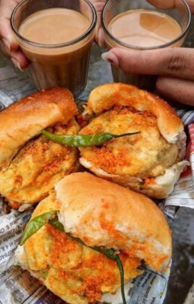 A classic street dish from Mumbai consisting of a soft bun wrapped around a spiced potato fritter and served with chutneys.