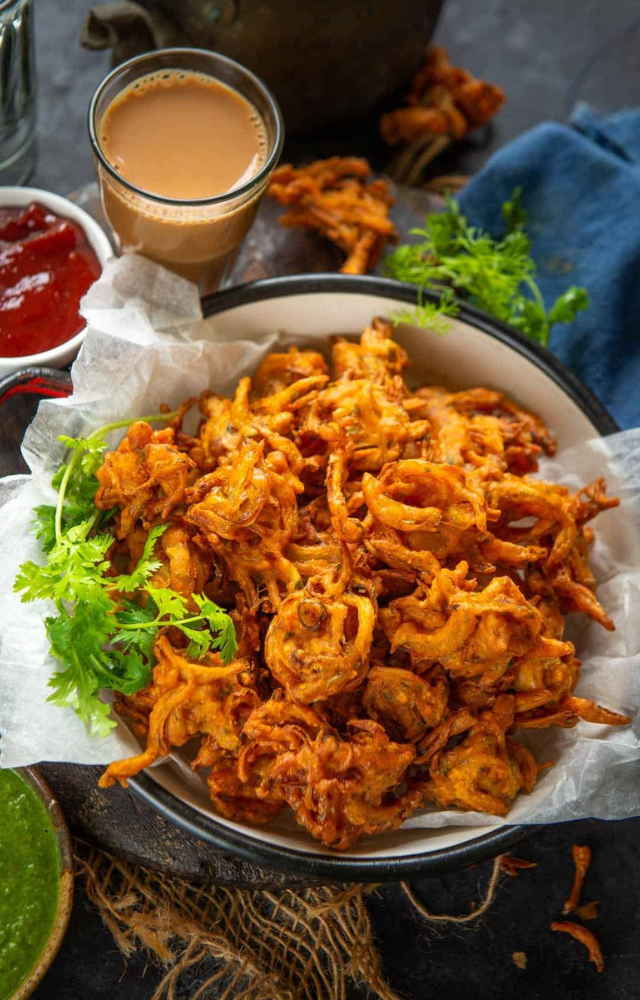 Explore the tasty and crispy world of Mumbai`s signature monsoon dish, bhajiyas. These are seasoned chickpea flour fritters topped with a batter made of onions