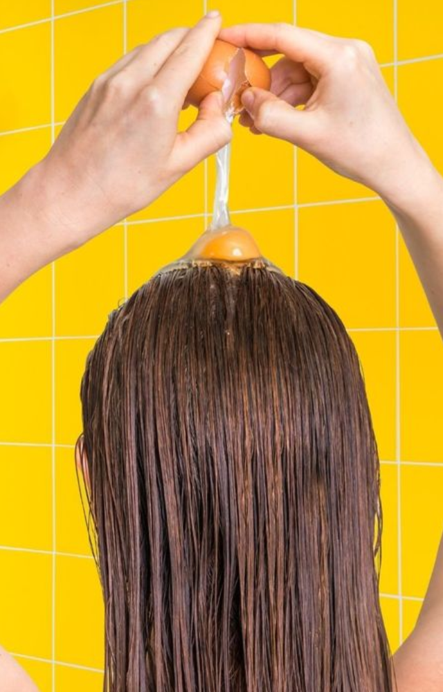 Because eggs are high in protein, frizz can be lessened by strengthening and smoothing the hair shaft. Whisk together one or two eggs and smear onto damp hair.