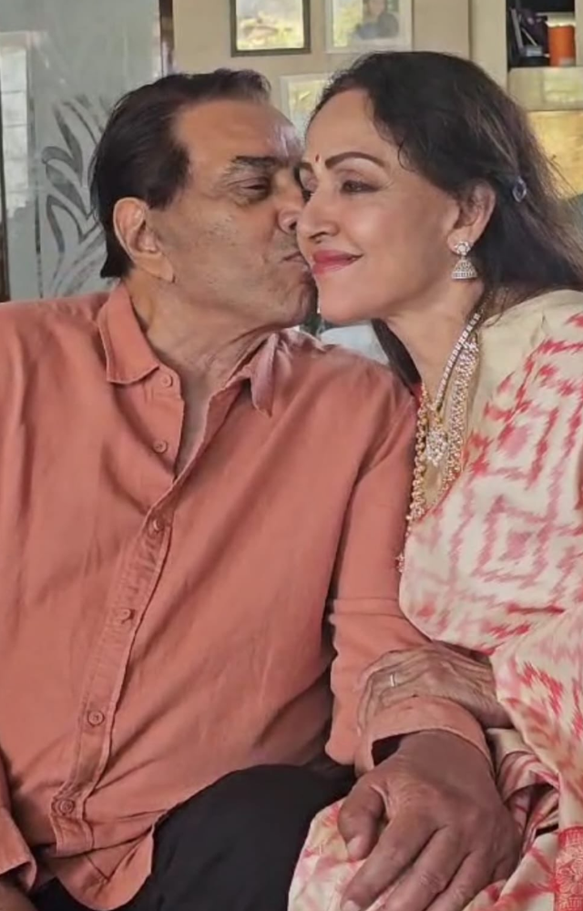 On the significant day of their wedding anniversary, Dharmendra gives Hema Malini a kiss and posts a sweet photo to Twitter