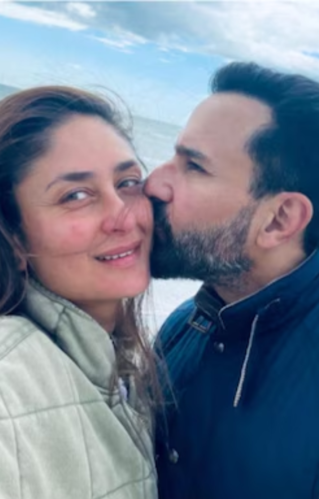 Saif Ali Khan shares a romantic moment with Kareena Kapoor, kissing her tenderly on the beach, their love and affection beautifully evident.