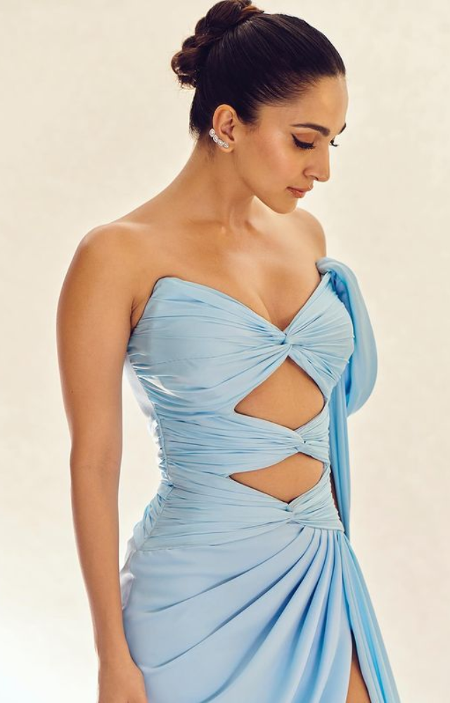 In a striking blue outfit, Kiara Advani sets fashion trends ablaze with her impeccable sense of style and grace.