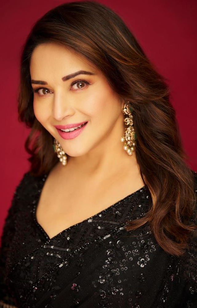 Madhuri Dixit stuns in a black saree, epitomizing grace and timeless beauty. A vision to behold