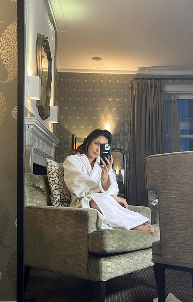 Malaika Arora captures a candid moment with a mirror selfie, radiating charm and sophistication effortlessly.