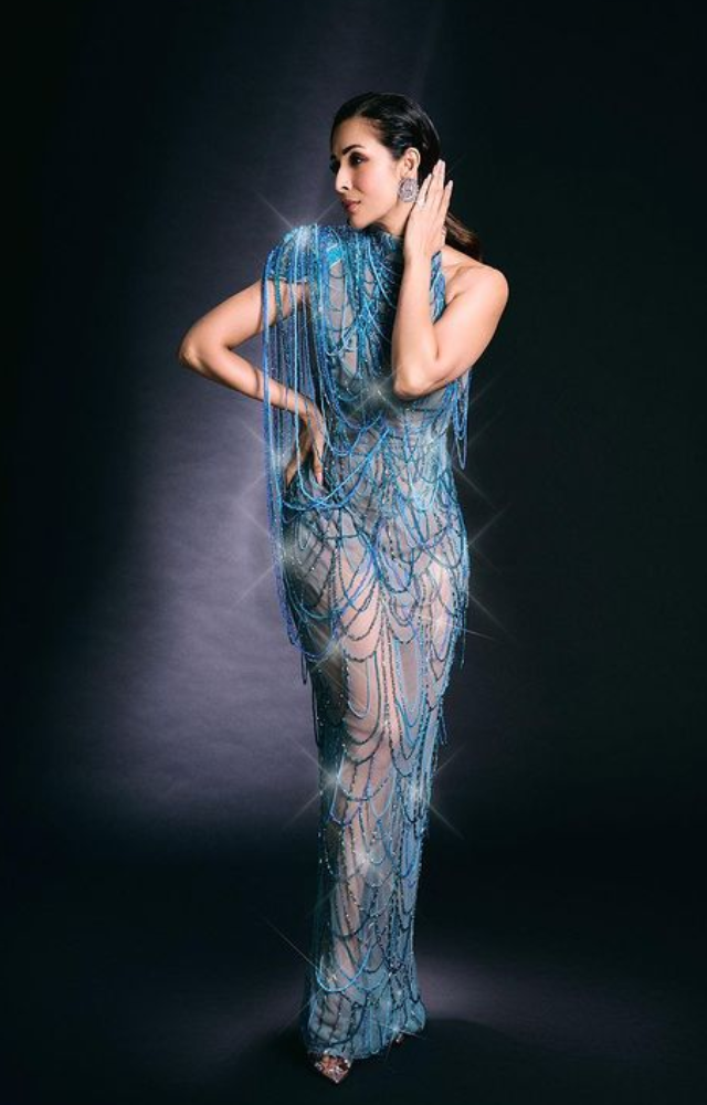 Malaika Arora, a genuine fashion queen who easily steals the show, dons a mesmerising blue gown to showcase her grace and composure.