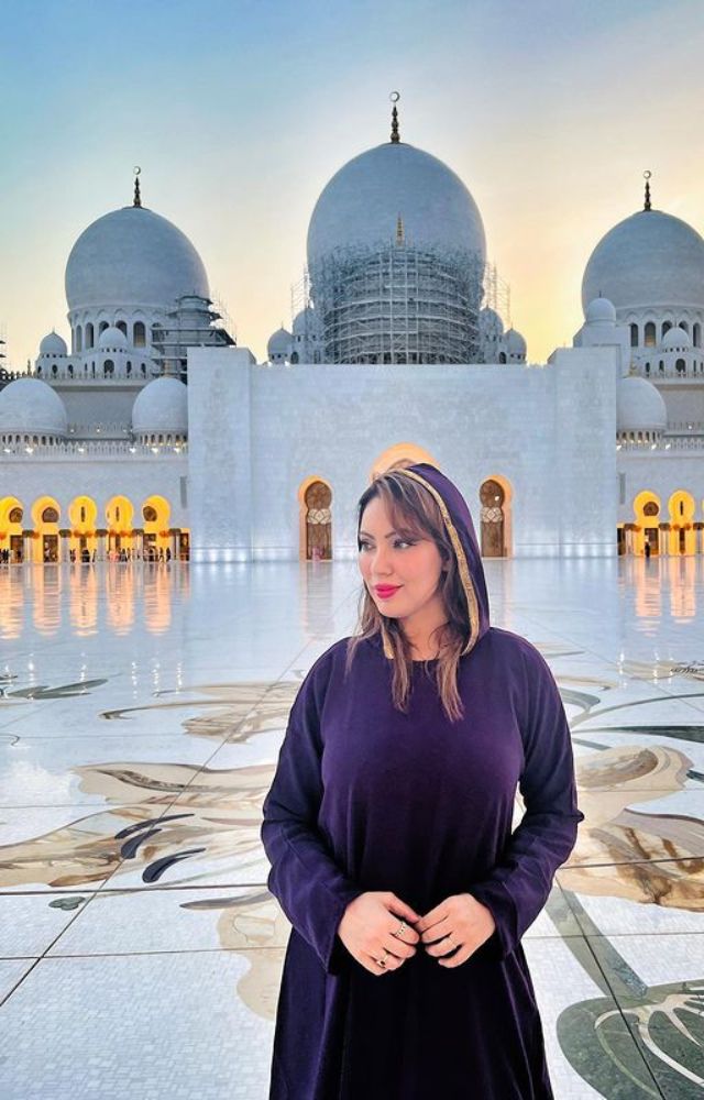 Absorbed in Sheikh Zayed Grand Mosque`s Beauty, Embracing Spiritual Connection.