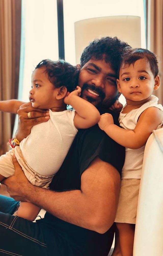 Vignesh Shivan finds joy in the company of both his sons, creating a bond that reflects the warmth of a loving family.