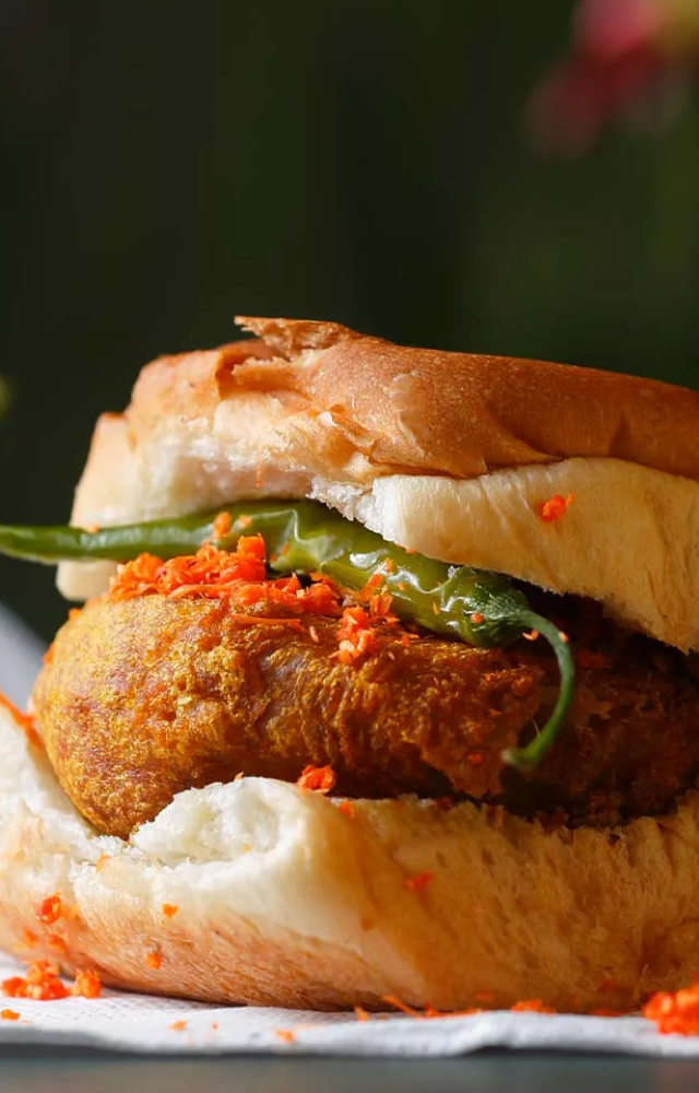 The delicious vada pav, a street snack iconic to Mumbai, is a spicy potato fry (vada) between soft pav bread. Every tourist to Mumbai should have this famous
