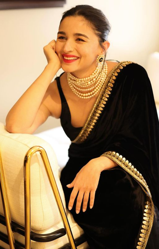 Witness Alia Bhatt`s glamour at its peak as she graces the event, anticipating the much-awaited release of `Poacher` on PrimeVideo.