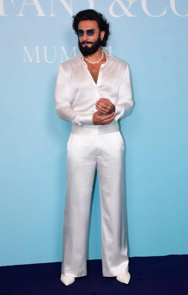 Ranveer Singh looks stunning in his all-white outfit. He`s stylish, confident, and grabs attention effortlessly. From his sharp suit to his cool accessories