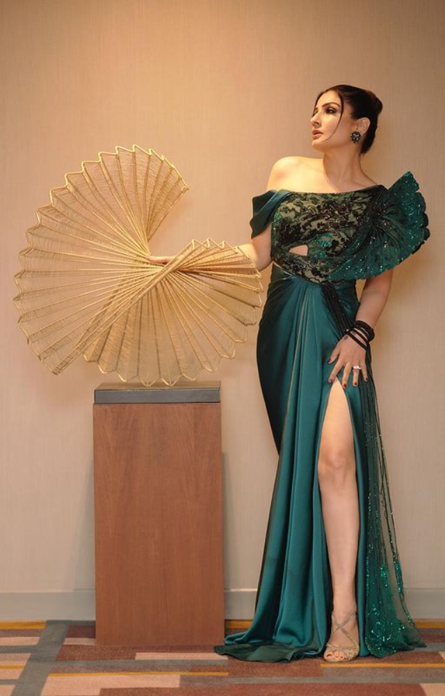 In a sage green attire, Raveena Tandon stands as a siren of style, effortlessly merging classic charm with contemporary allure.
