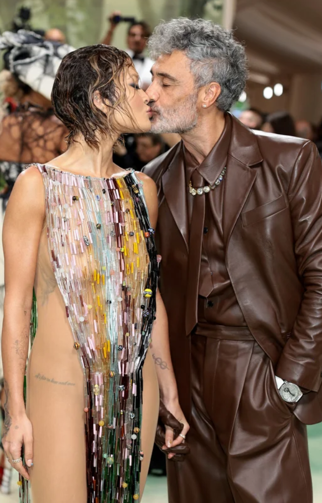 Another seasoned Met Gala couple, Taika Waititi and Rita Ora, looked stunning as they shared a passionate kiss on the red carpet