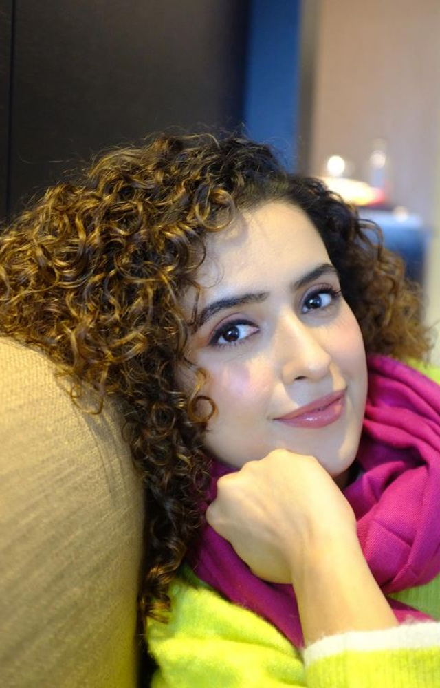 Picture-Perfect Pose: Sanya Malhotra strikes a pose, ensuring every click is a masterpiece, showcasing her natural grace and photogenic allure.