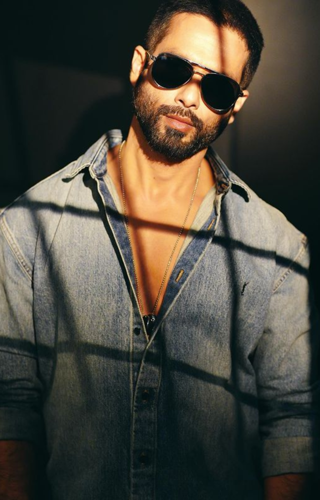 Shahid rocks a cool aura in blue denim paired with sleek black shades, epitomizing effortless style and trendsetting charm.
